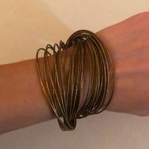 Cluster of gold metal bangles
